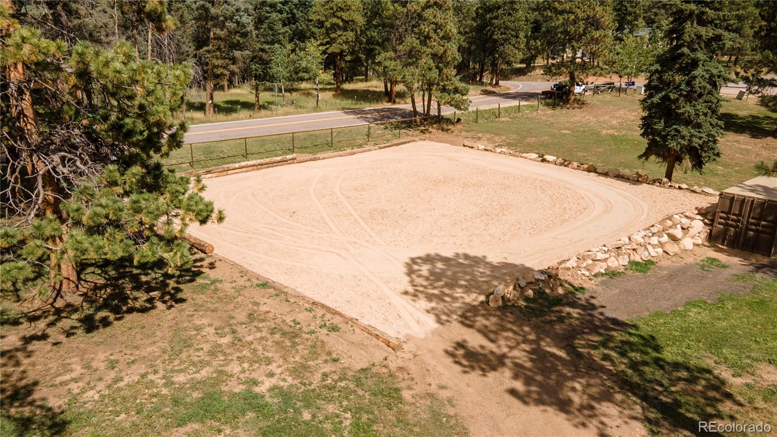 12322 South Wamblee Valley Road Conifer, CO 80433 - Photo 4 of 37 a view of a swimming pool with a yard
