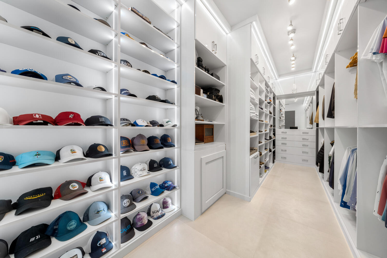 1900 Sabal Palm Drive Boca Raton, FL 33432 - Photo 21 of 75 a view of walk in closet with clothes and shoes