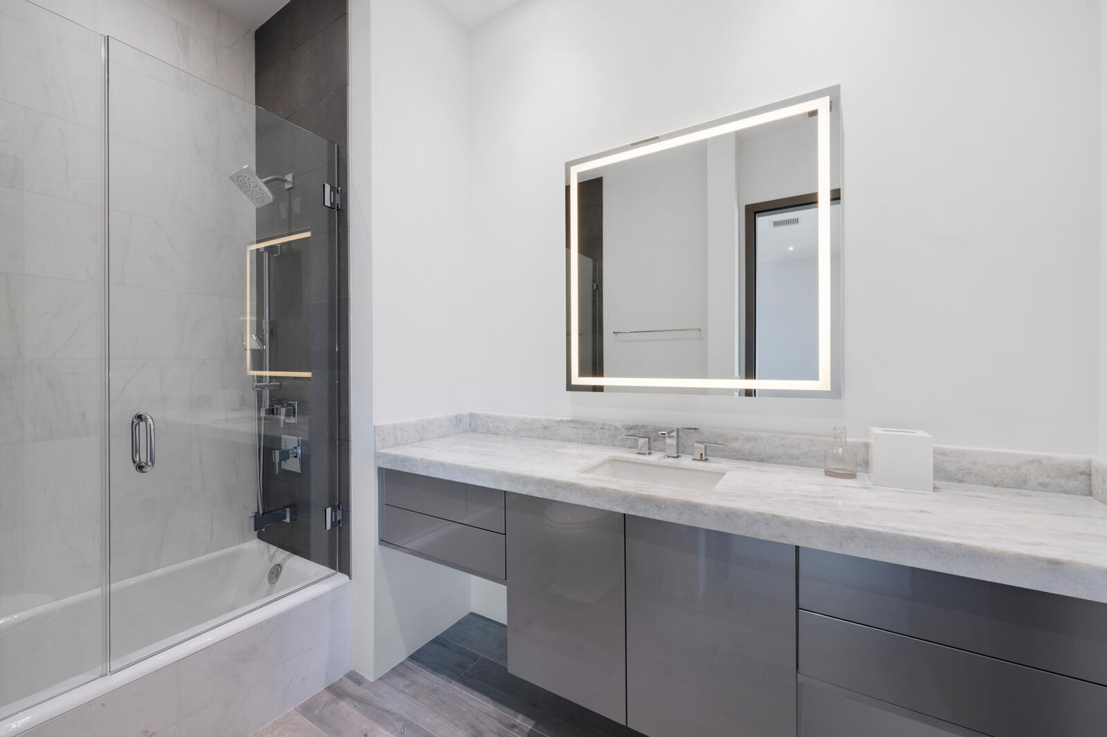 1900 Sabal Palm Drive Boca Raton, FL 33432 - Photo 23 of 75 a bathroom with a bathtub shower sink vanity and mirror