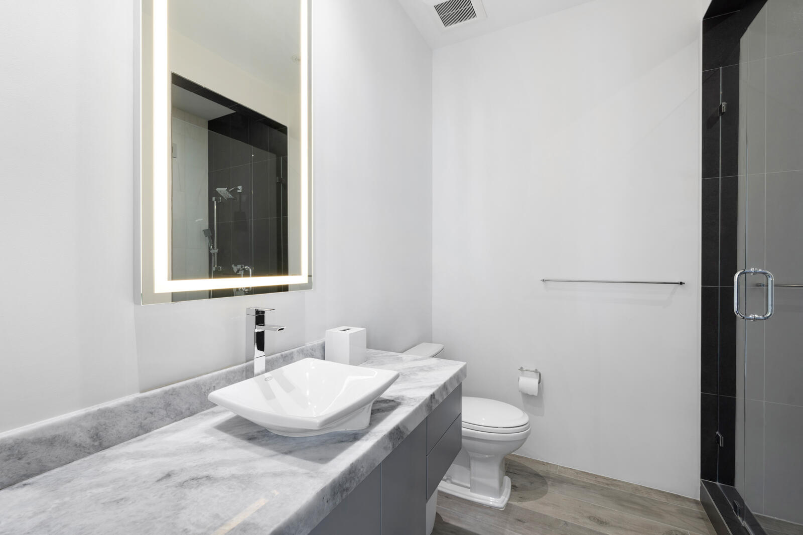 1900 Sabal Palm Drive Boca Raton, FL 33432 - Photo 25 of 75 a bathroom with a granite countertop sink toilet and mirror