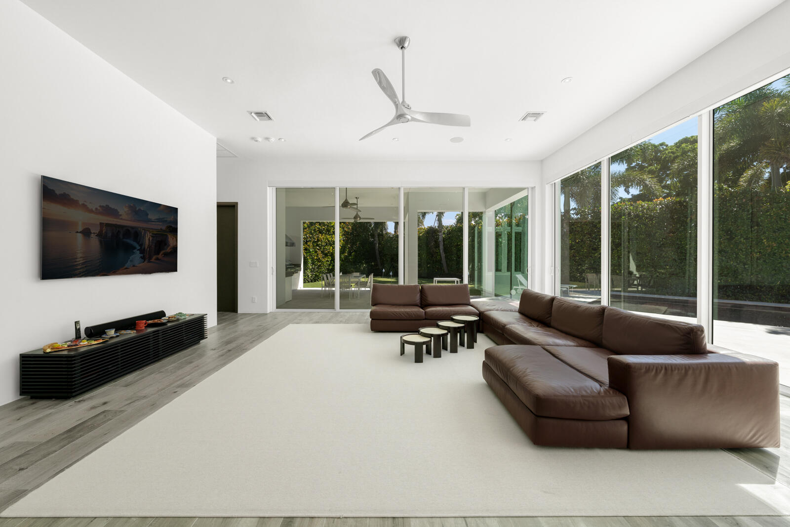 1900 Sabal Palm Drive Boca Raton, FL 33432 - Photo 41 of 75 a living room with furniture and a flat screen tv