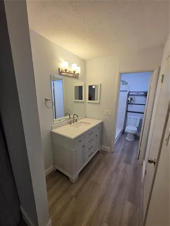 a bathroom with a double vanity sink and mirror