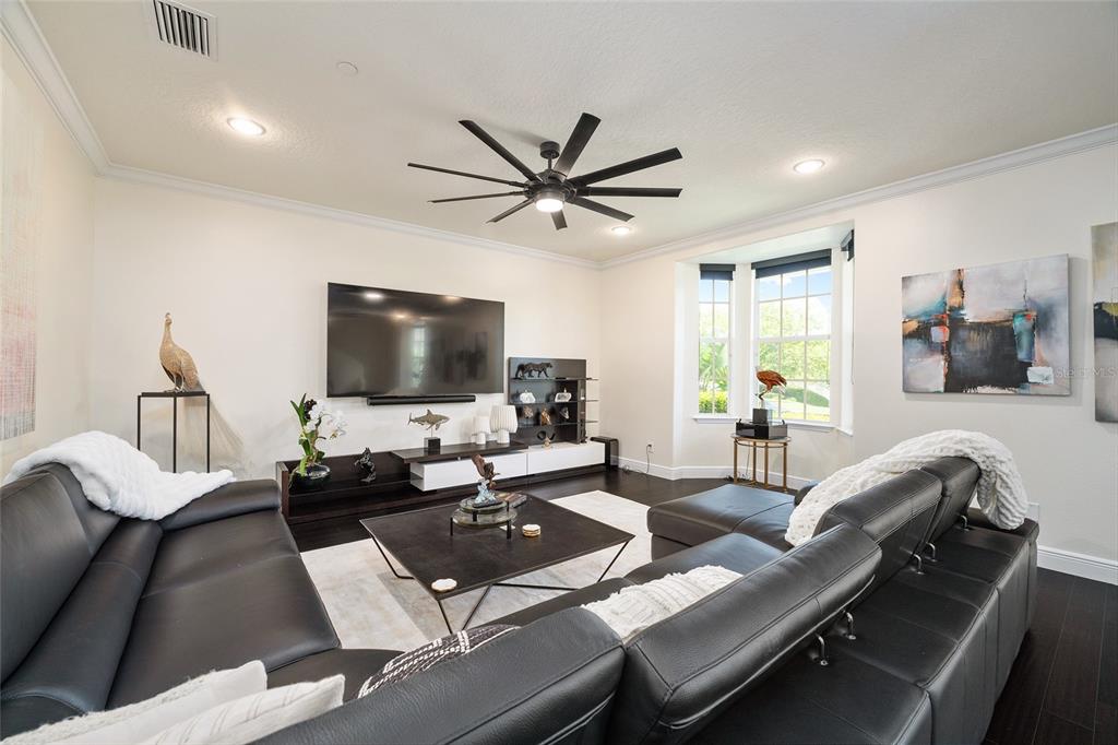 152 Riggings Way Clermont, FL 34711 - Photo 11 of 68 a living room with furniture and a flat screen tv
