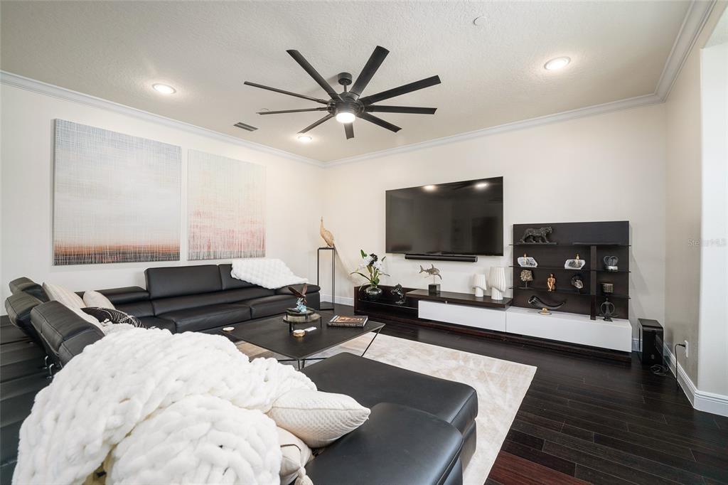 152 Riggings Way Clermont, FL 34711 - Photo 12 of 68 a living room with furniture and a flat screen tv