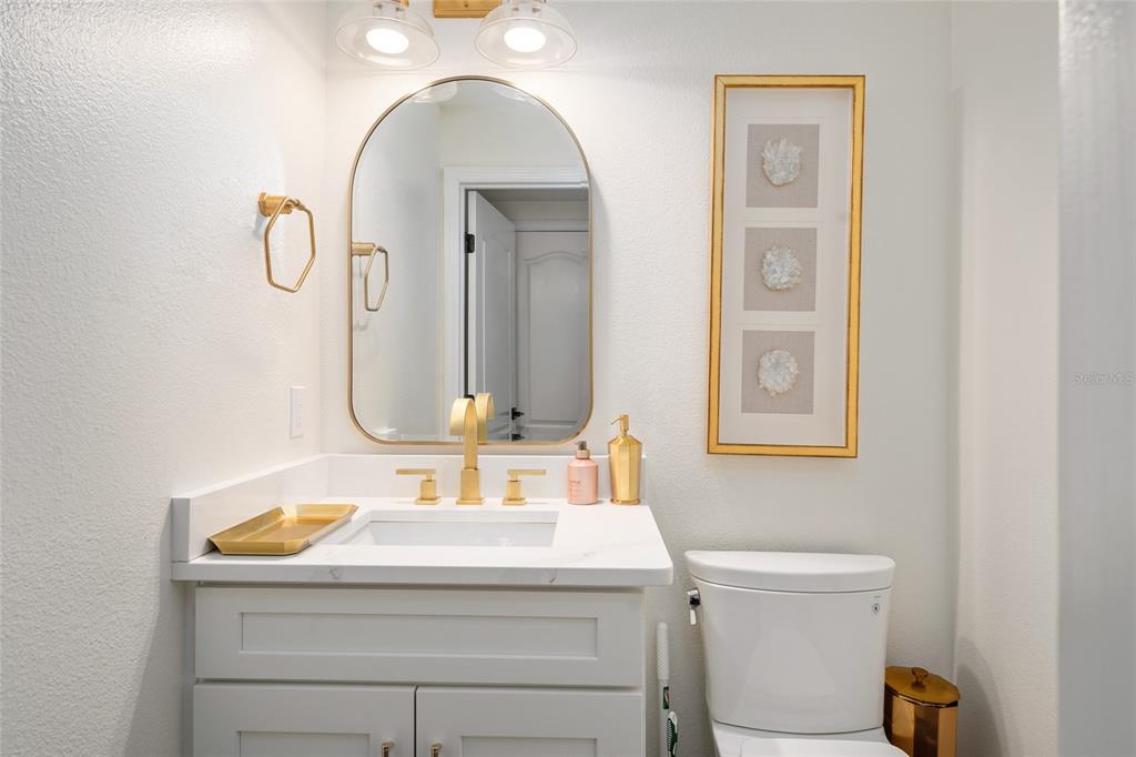 152 Riggings Way Clermont, FL 34711 - Photo 18 of 68 a bathroom with a sink and a mirror