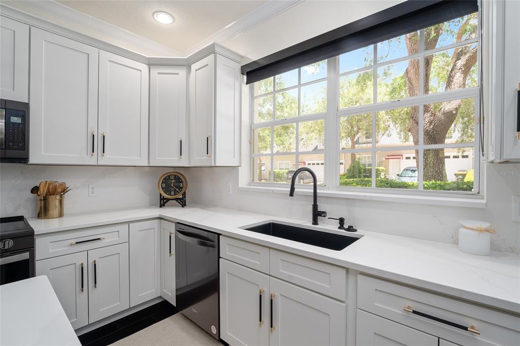 152 Riggings Way Clermont, FL 34711 - Photo 25 of 68 a kitchen with appliances cabinets and a sink