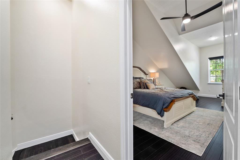 152 Riggings Way Clermont, FL 34711 - Photo 31 of 68 a bedroom with a bed and wooden floor