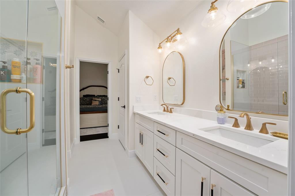 152 Riggings Way Clermont, FL 34711 - Photo 39 of 68 a spacious bathroom with a double vanity sink and mirror