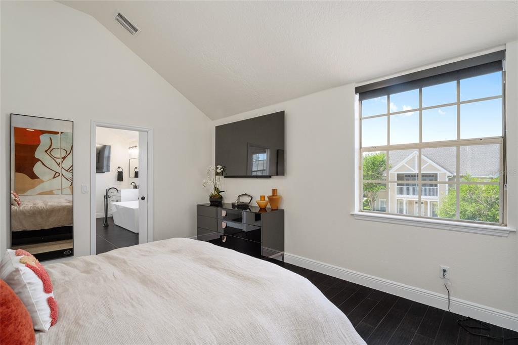 152 Riggings Way Clermont, FL 34711 - Photo 46 of 68 a bedroom with a bed and a large window