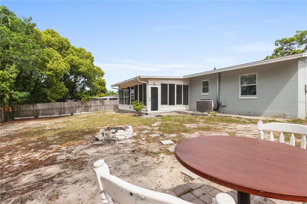 7208 Fair Oaks Street Spring Hill, FL 34606 - Photo 21 of 25 a view of a house with swimming pool