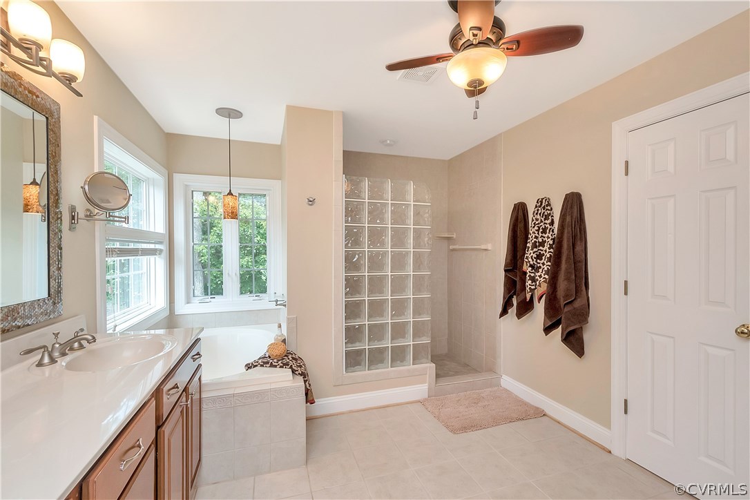 10705 Chatham Ridge Way Spotsylvania, VA 22551 - Photo 19 of 40 a very nice looking room with a large window and chandelier