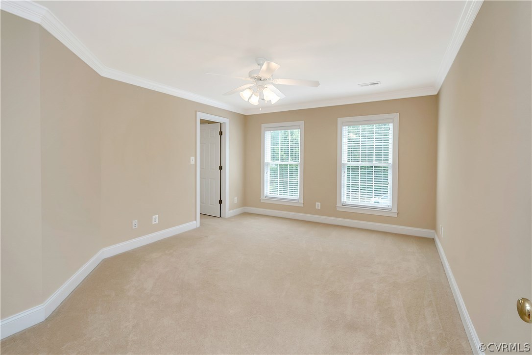 10705 Chatham Ridge Way Spotsylvania, VA 22551 - Photo 21 of 40 an empty room with windows and chandelier fan