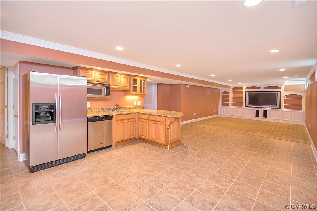10705 Chatham Ridge Way Spotsylvania, VA 22551 - Photo 27 of 40 a large kitchen with stainless steel appliances a refrigerator and a stove top oven