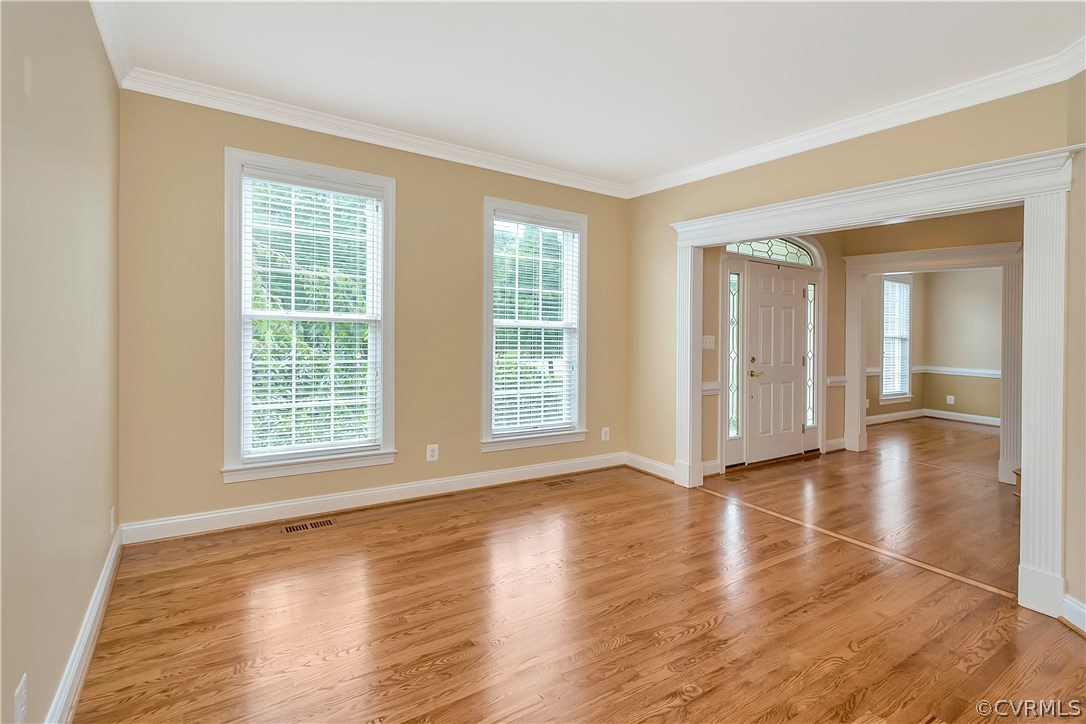 10705 Chatham Ridge Way Spotsylvania, VA 22551 - Photo 3 of 40 an empty room with wooden floor and windows