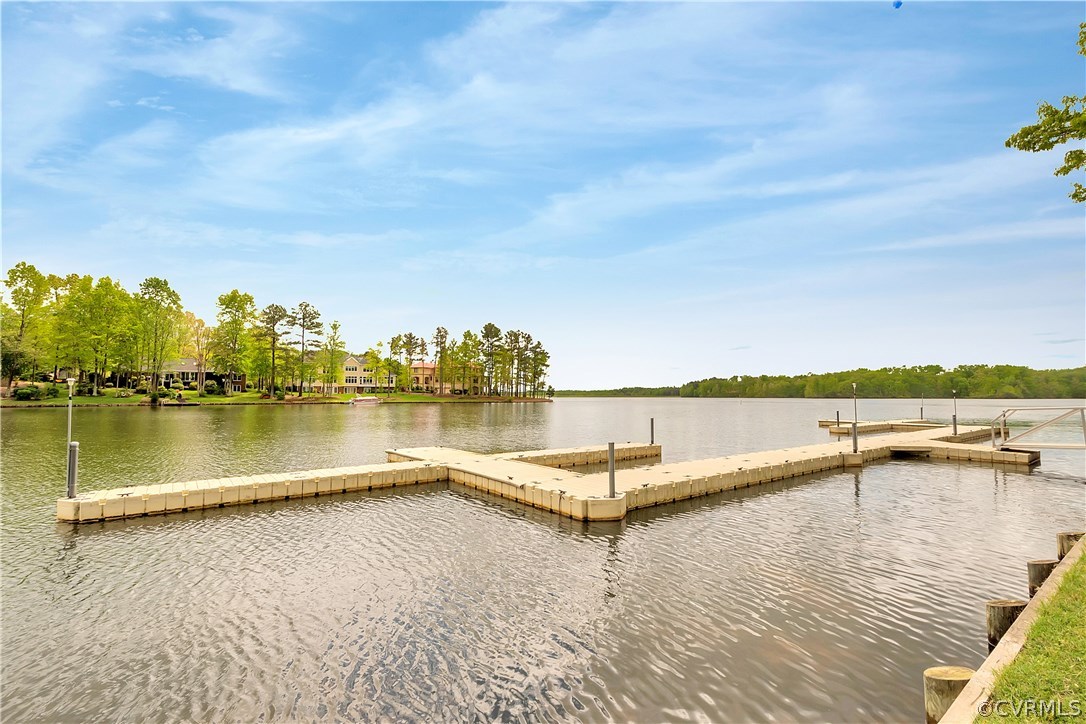 10705 Chatham Ridge Way Spotsylvania, VA 22551 - Photo 37 of 40 a view of a lake with a table and chairs