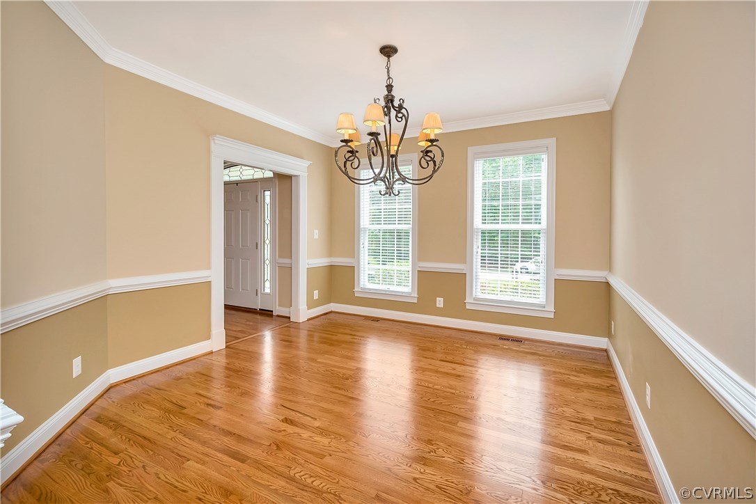 10705 Chatham Ridge Way Spotsylvania, VA 22551 - Photo 4 of 40 a view of livingroom with wooden floor and chandelier