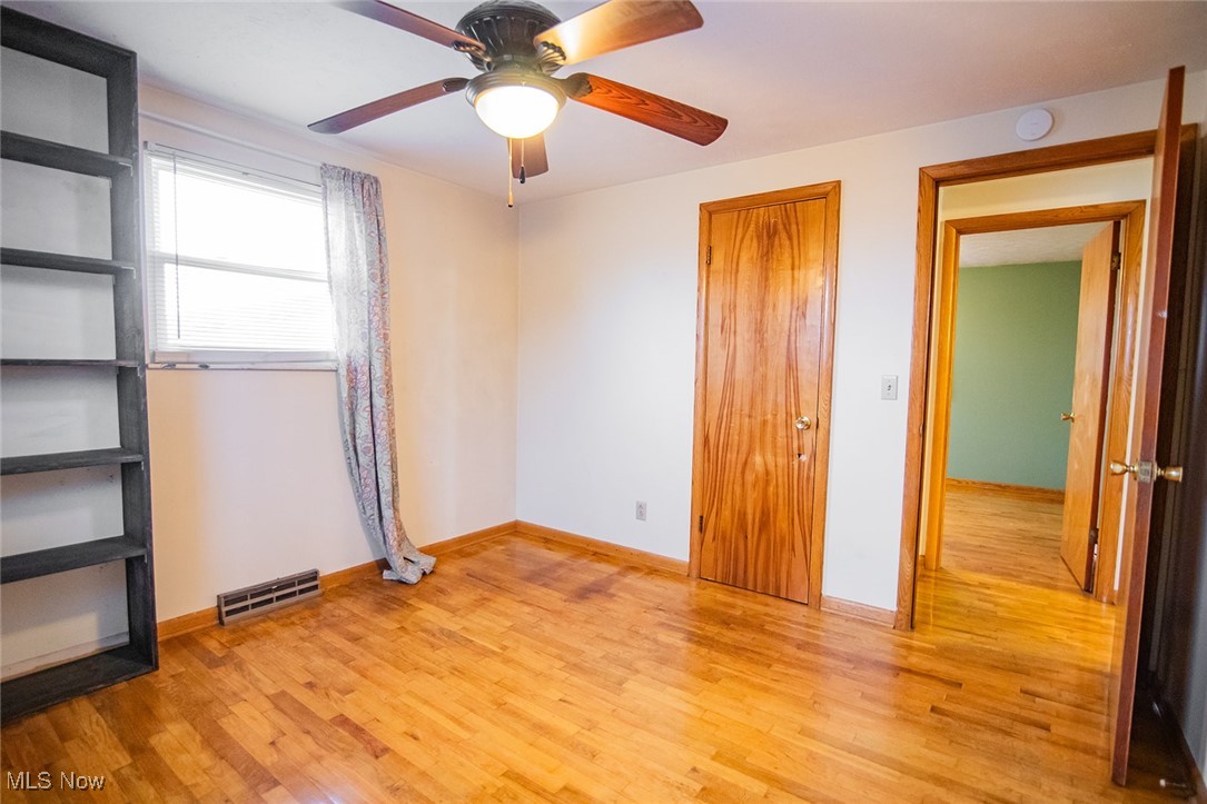 91 Mike Street Washington, WV 26181 - Photo 22 of 42 Unfurnished bedroom featuring light wood-type flooring and a ceiling fan