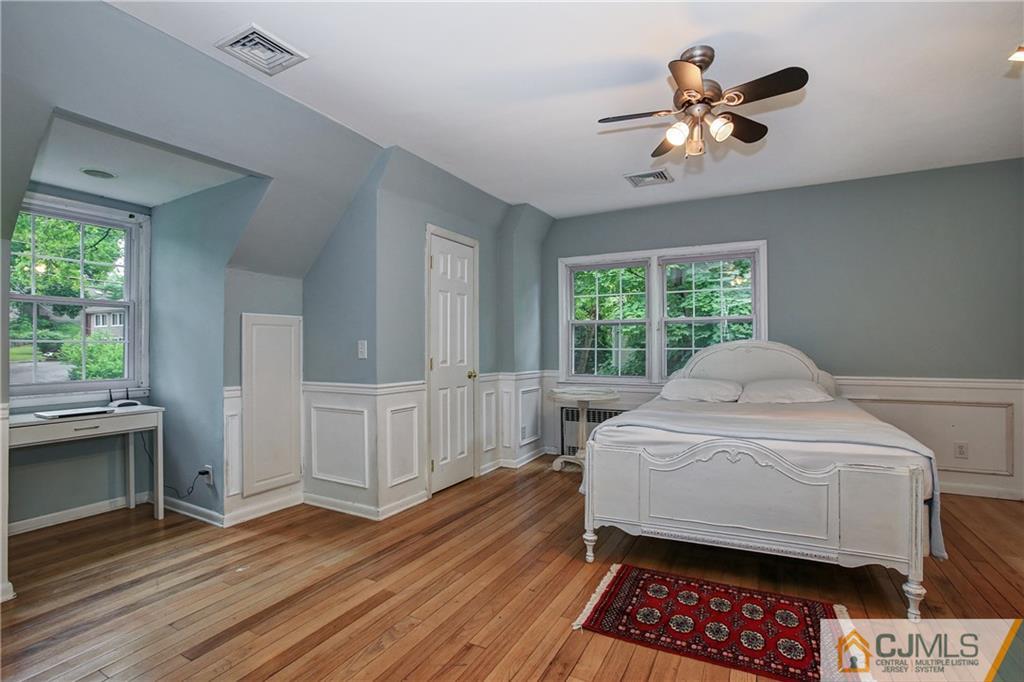 16 Oak Hills Road Edison, NJ 08820 - Photo 14 of 25 a bed room with a bed and a window