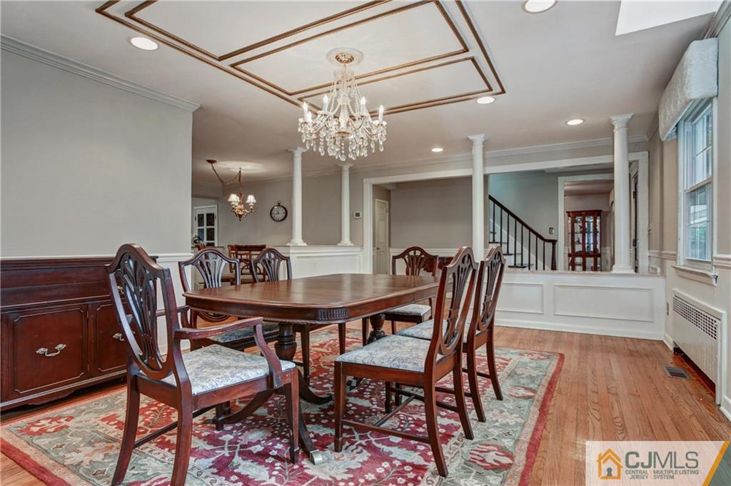 16 Oak Hills Road Edison, NJ 08820 - Photo 3 of 25 a view of a dining room with furniture and wooden floor