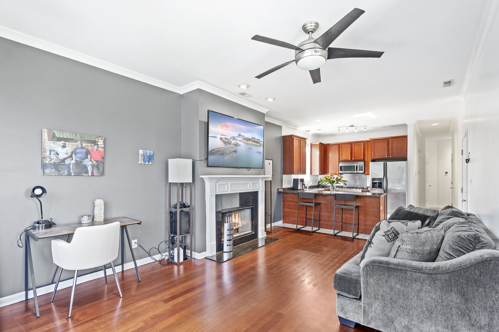 2539 West Warren Boulevard, Unit 2 Chicago, IL 60612 - Photo 5 of 14 a living room with furniture and a fireplace