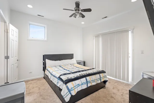 a bedroom with a bed and window