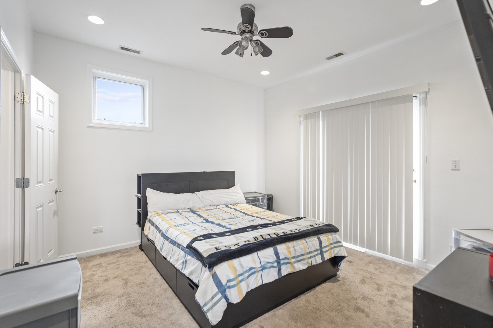 2539 West Warren Boulevard, Unit 2 Chicago, IL 60612 - Photo 10 of 14 a bedroom with a bed and window