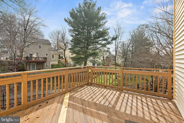 a view of a wooden deck with trees