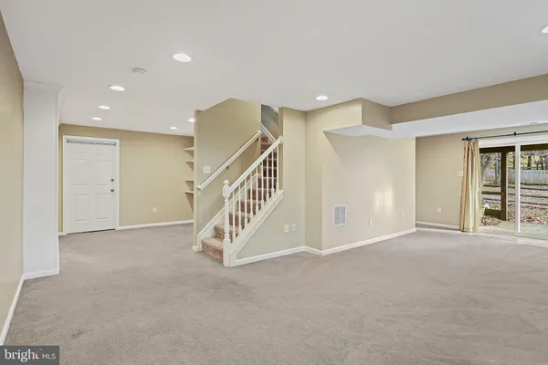 a view of an empty room with stairs