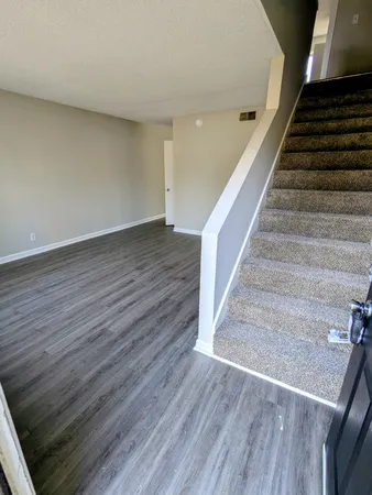 a view of entryway with wooden floor