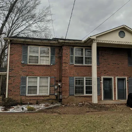 a front view of a house with a garage