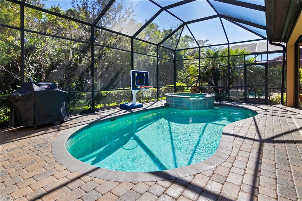 a view of a swimming pool with a patio
