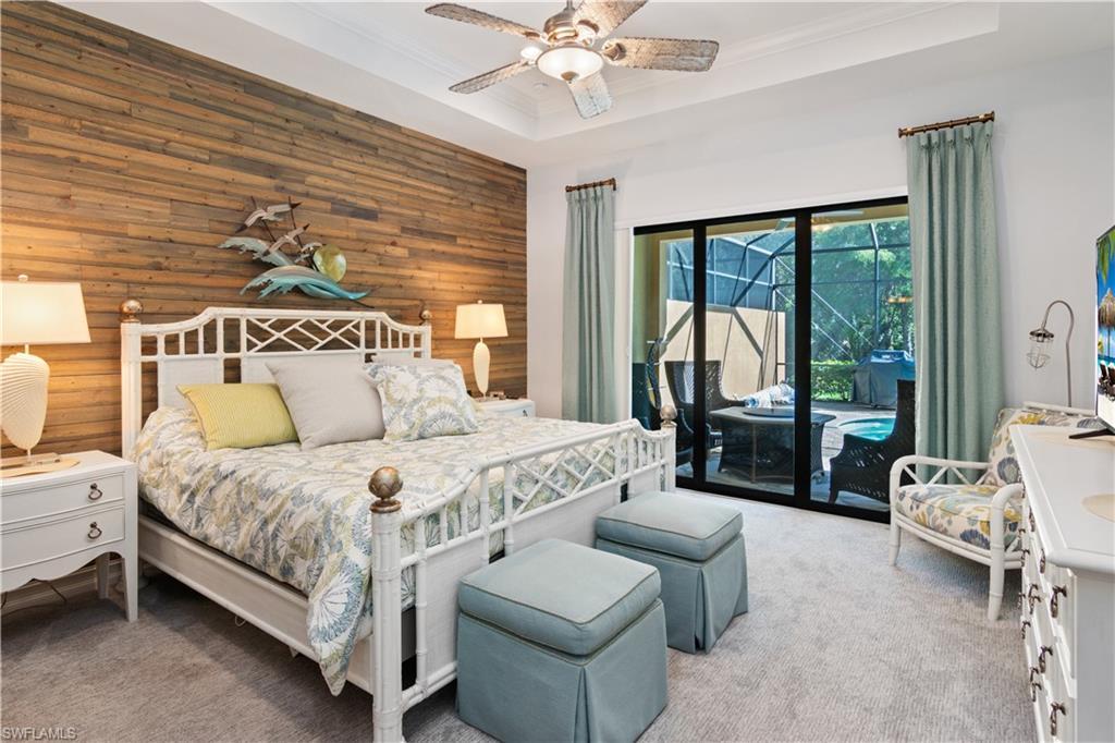 6604 Roma Way Naples, FL 34113 - Photo 13 of 21 a bedroom with a bed couch and a large window