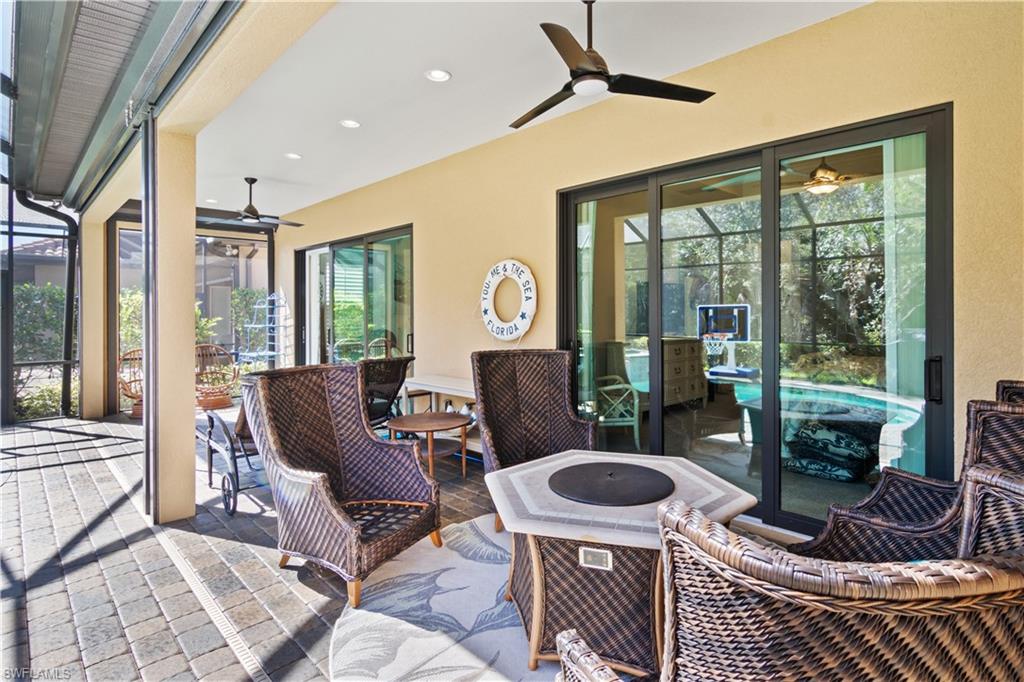 6604 Roma Way Naples, FL 34113 - Photo 16 of 21 a outdoor living space with furniture and a rug