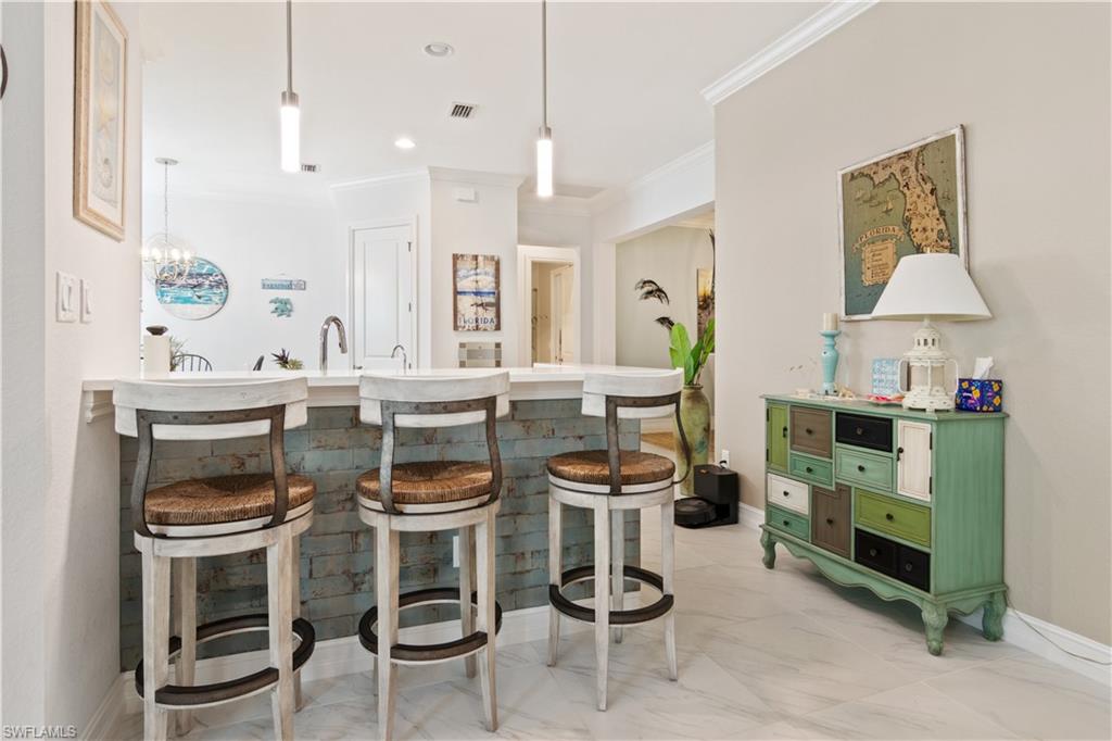6604 Roma Way Naples, FL 34113 - Photo 4 of 21 a dining room with furniture and window