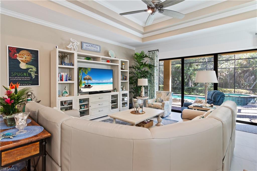 6604 Roma Way Naples, FL 34113 - Photo 7 of 21 a room with furniture and a large window