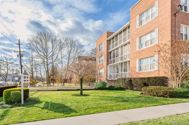 a view of a apartment with a yard