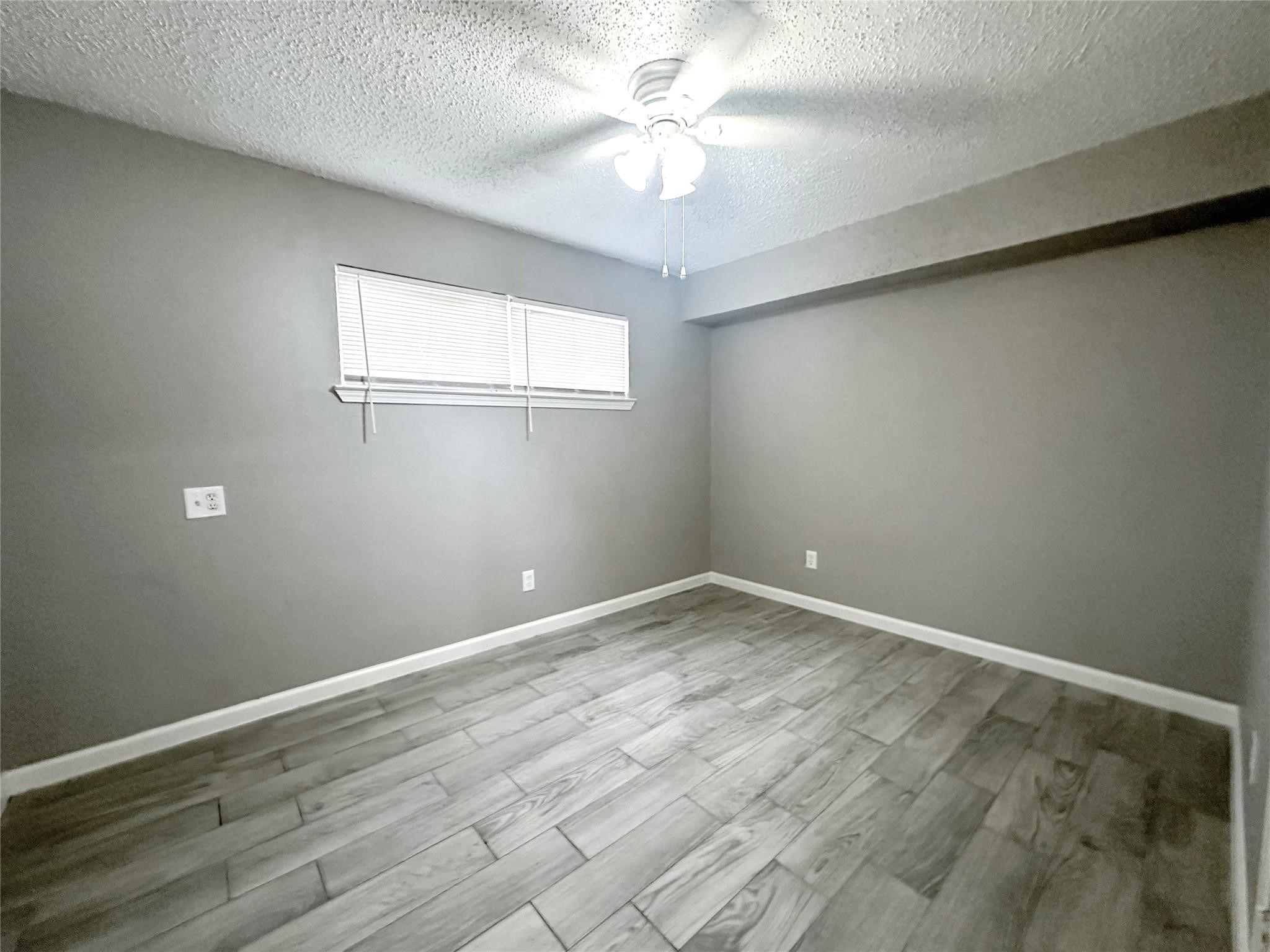 5418 Weaver Road, Unit A Houston, TX 77016 - Photo 6 of 9 a view of an empty room with a window
