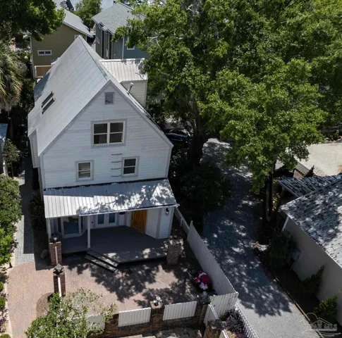 a view of house with backyard space and sitting area