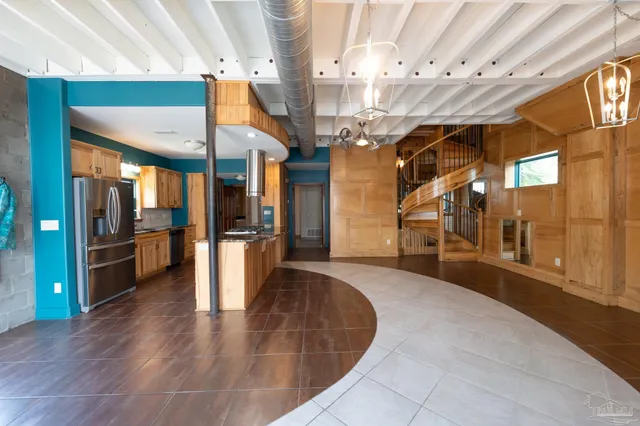 a view of a room with lots of wooden furniture