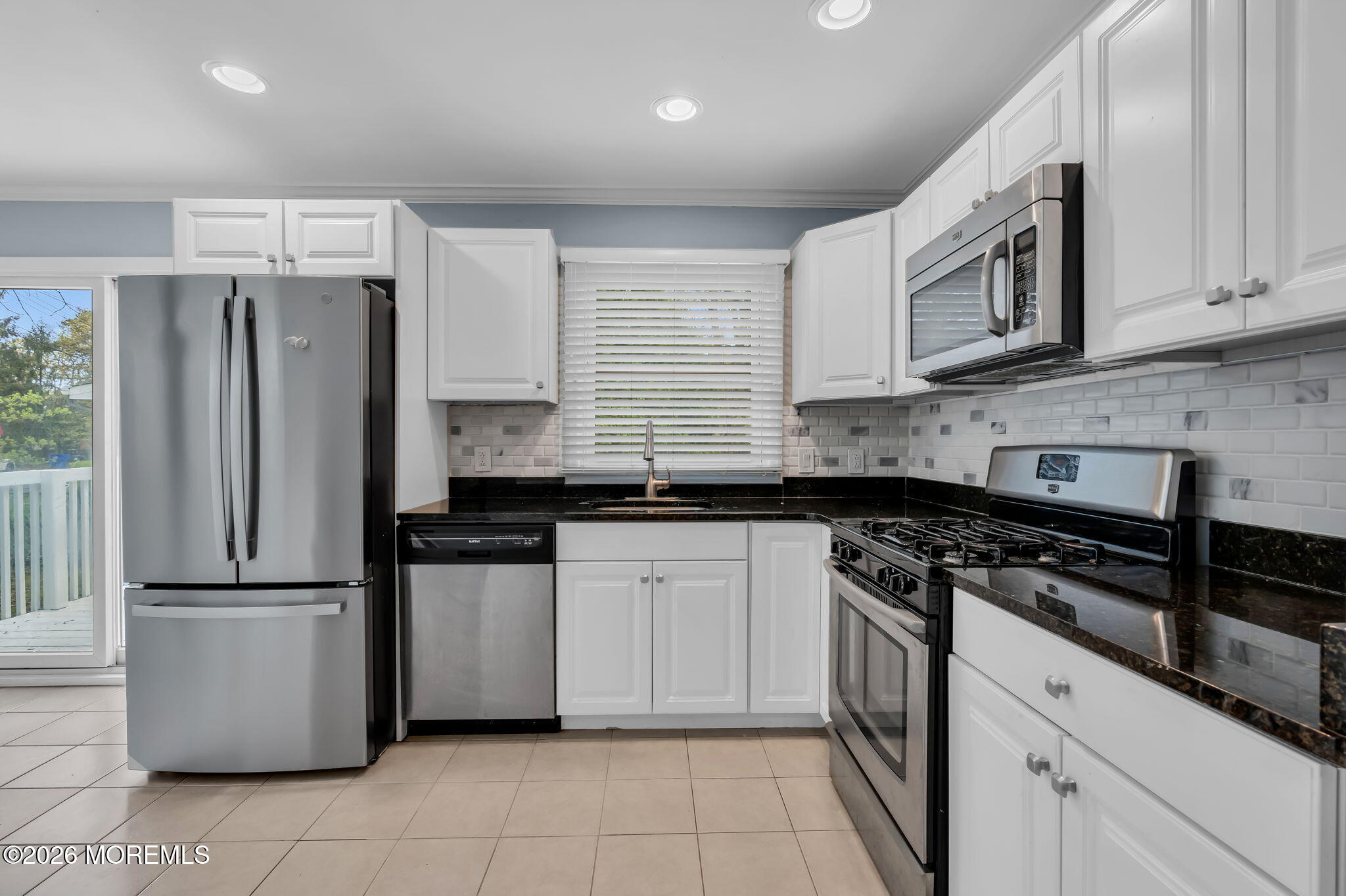 593 Beach Plum Road Brick, NJ 08723 - Photo 13 of 38 a kitchen with stainless steel appliances granite countertop a refrigerator stove a sink and dishwasher