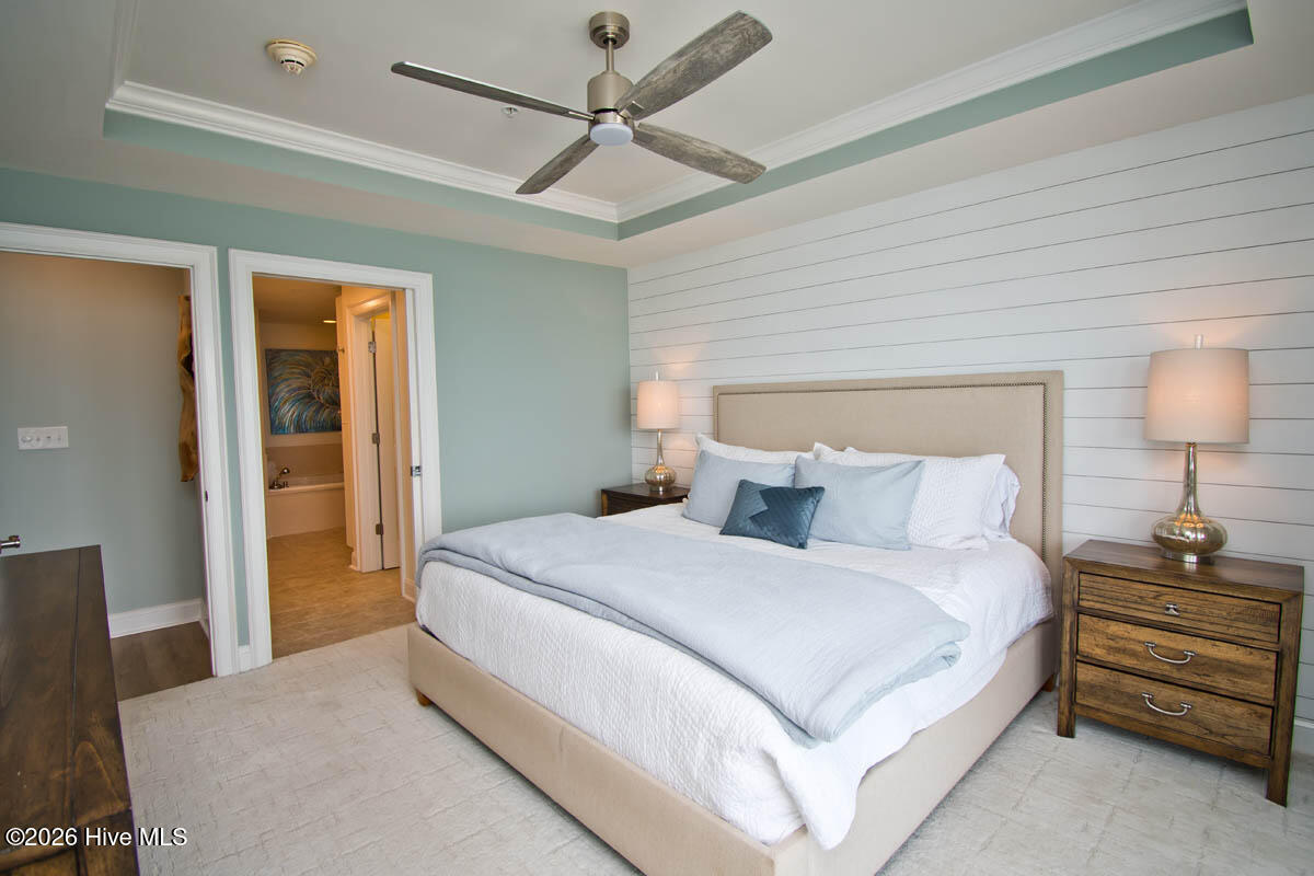 1550 Salter Path Road, Unit 409 Indian Beach, NC 28512 - Photo 14 of 45 Primary bedroom, walk-in closet and spacious bathroom.