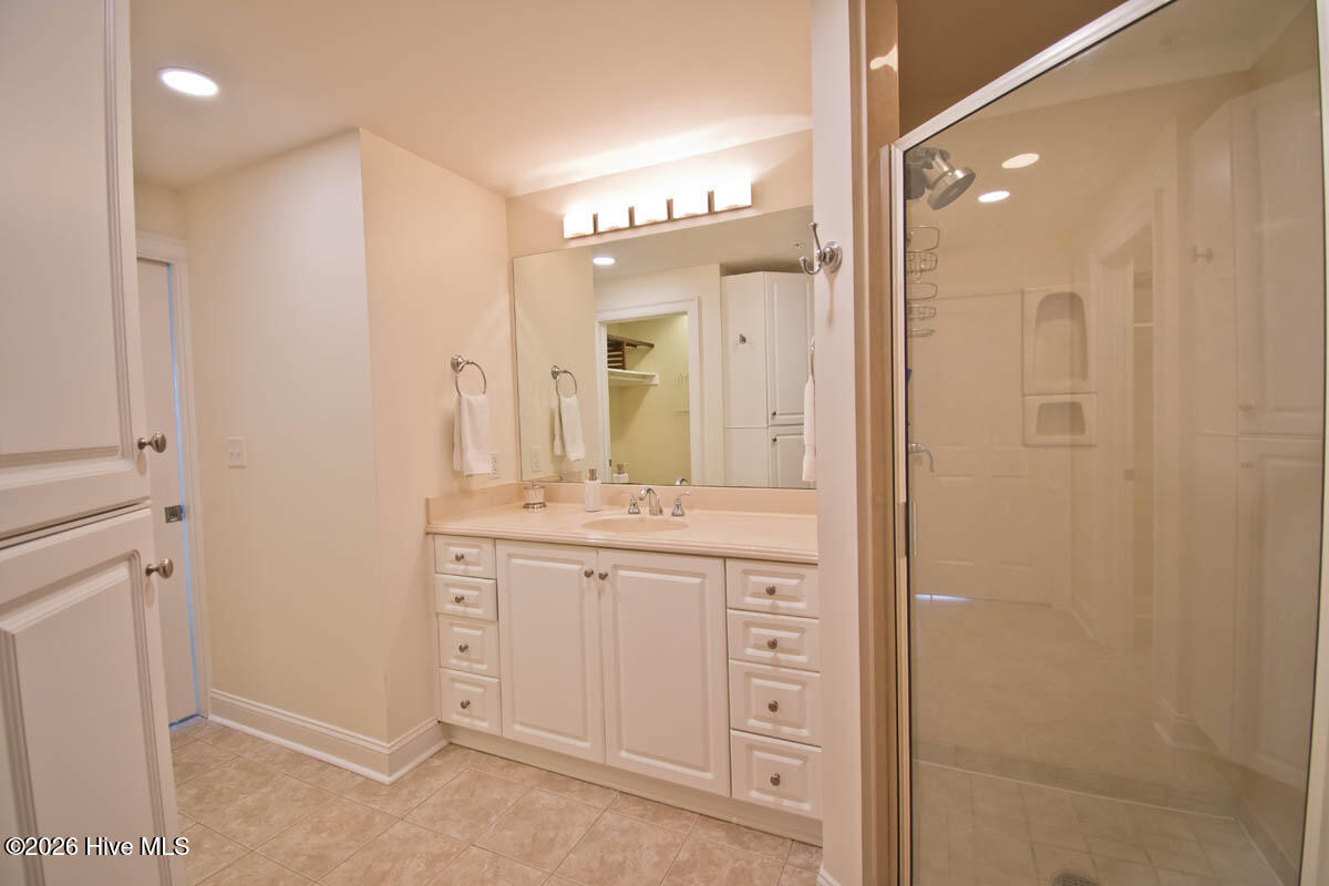 1550 Salter Path Road, Unit 409 Indian Beach, NC 28512 - Photo 17 of 46 Primary bath with walk-in shower.