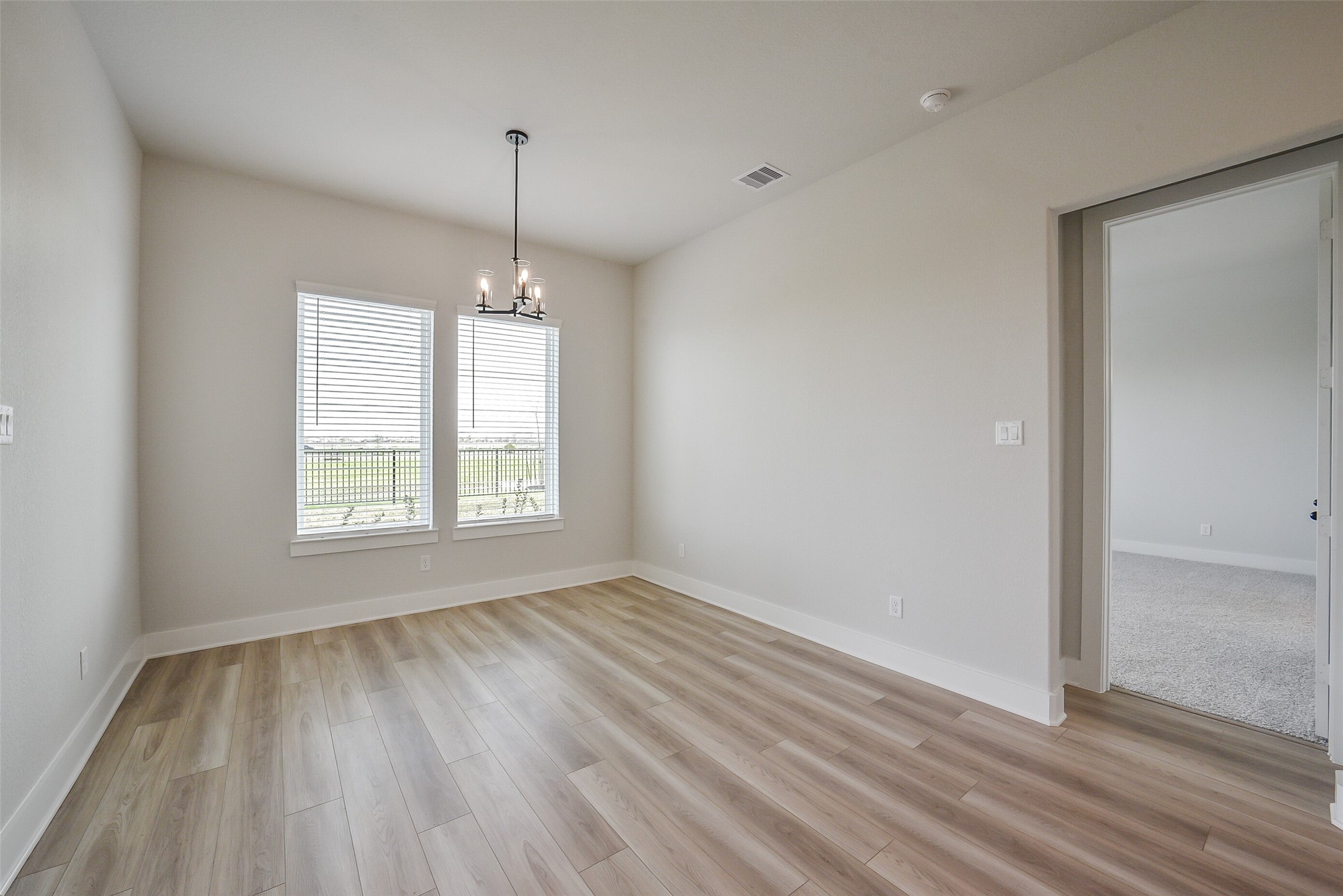 1831 Tioga Vw Drive Rosharon, TX 77583 - Photo 30 of 50 a view of an empty room with wooden floor and a window