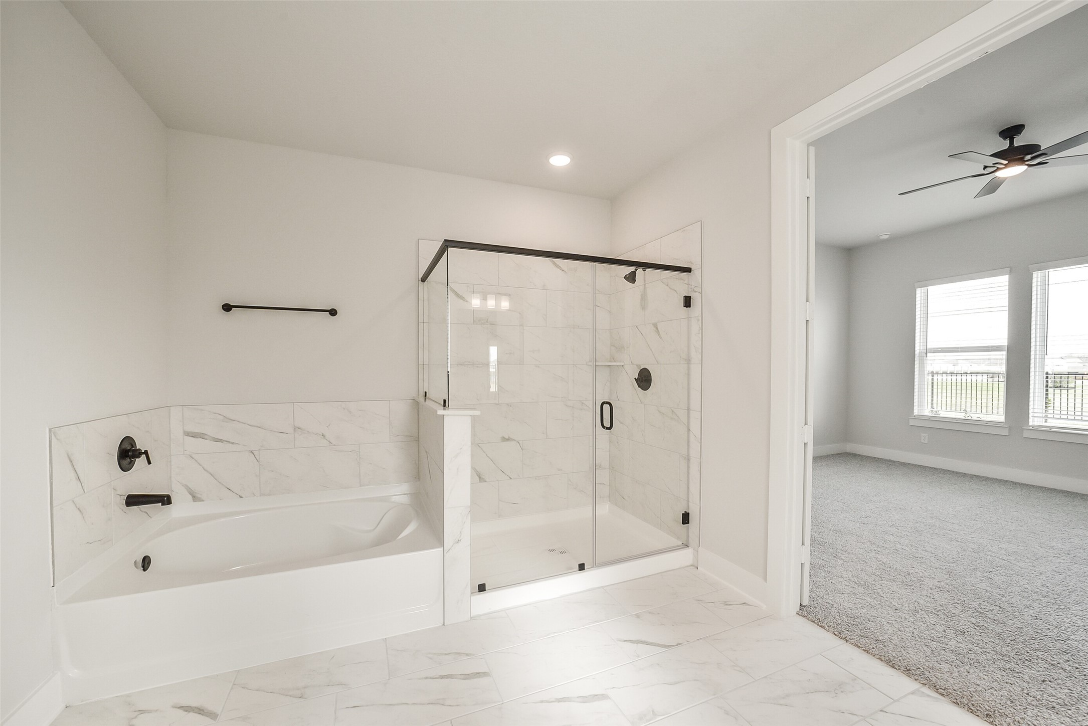 1831 Tioga Vw Drive Rosharon, TX 77583 - Photo 37 of 50 a bathroom with a bathtub and a shower