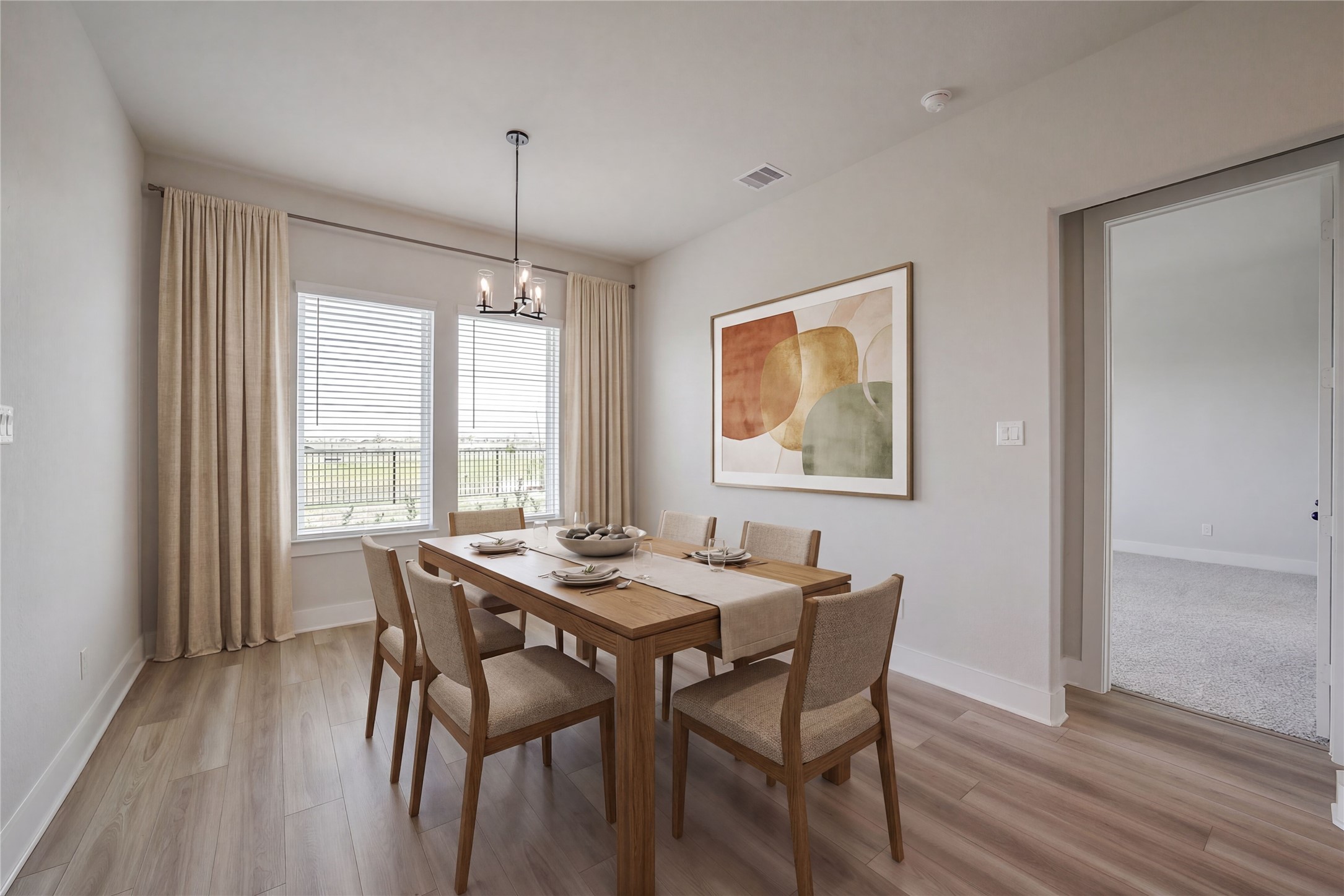 1831 Tioga Vw Drive Rosharon, TX 77583 - Photo 7 of 50 a dining room with furniture a chandelier and wooden floor