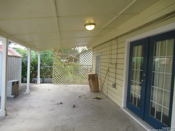 a view of a porch with furniture