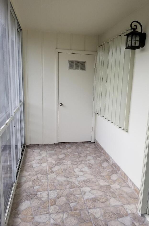 461 Burgundy North Delray Beach, FL 33484 - Photo 7 of 8 Rear Exterior