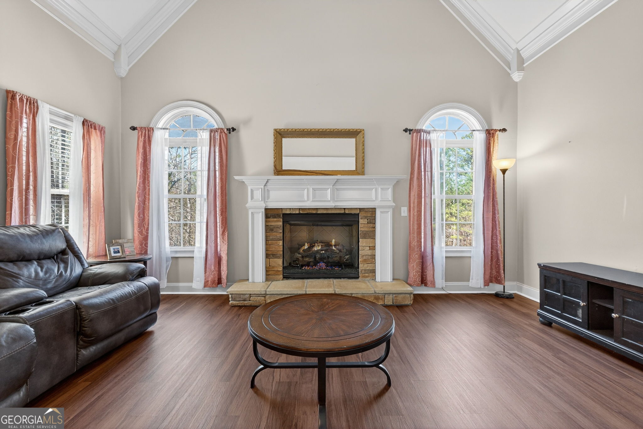 32 River Rapids Drive Forsyth, GA 31029 - Photo 14 of 32 a living room with furniture and a fireplace