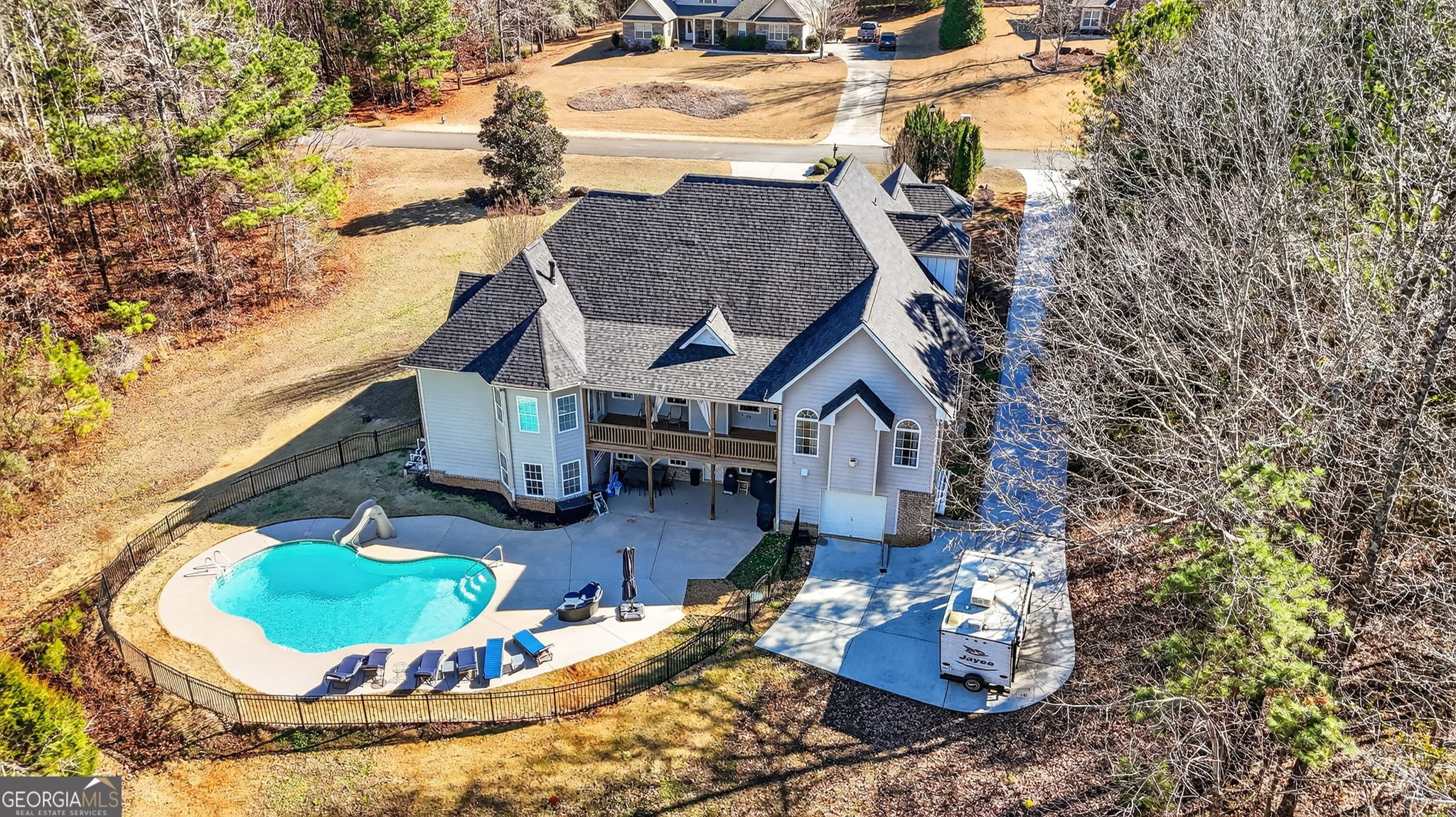 32 River Rapids Drive Forsyth, GA 31029 - Photo 30 of 32 a aerial view of a house with yard swimming pool and outdoor seating