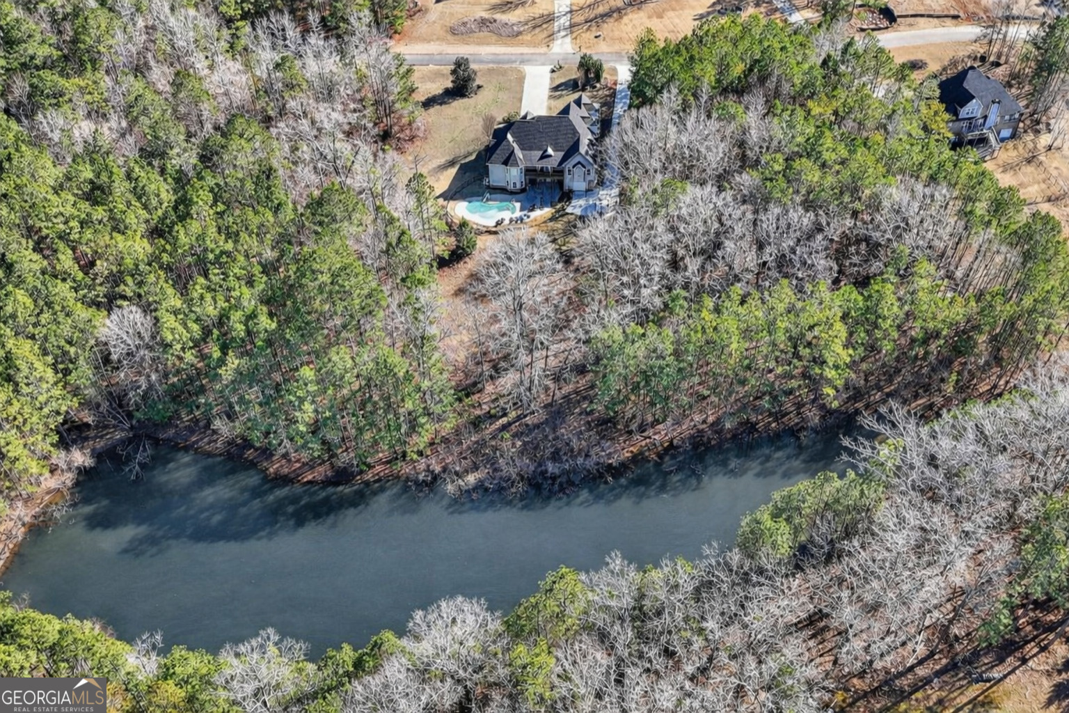32 River Rapids Drive Forsyth, GA 31029 - Photo 3 of 32 an aerial view of a house with a yard and lake view